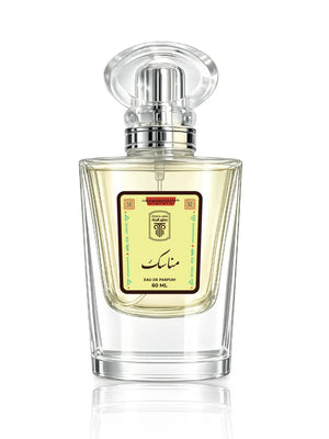 Flacon de luxe du parfum Manassik par Otour Al Janna, révélant un élixir oriental aux notes de cuir, oud et vétiver d'Haïti